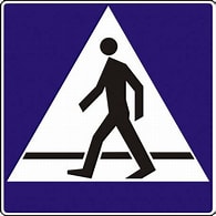 znak przejściem dla pieszych , na niebieskim tle postać przechodząca na pasach