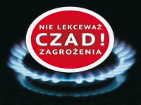 Plakat reklamowy przedstawia palnik gazu, na którym jest napis Czad - nie lekceważ zagrożenia