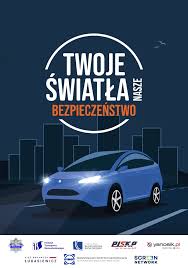 plakat ogólnopolskiej kampanii przestawiający animację pojazdu wraz z hasłem Twoje Światła - Nasze Bezpieczeństwo