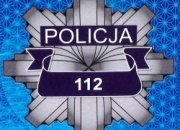 Na zdjęciu logo Policji, na nim numer alarmowy 112.