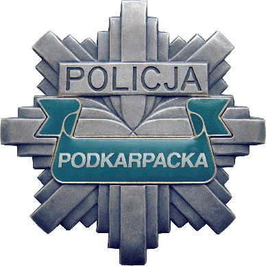 Na zdjęciu znajduje się policyjna odznaka z napisem Policja Podkarpacka