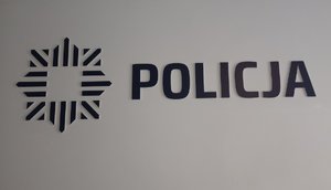 Na zdjęciu logo i napis policja.