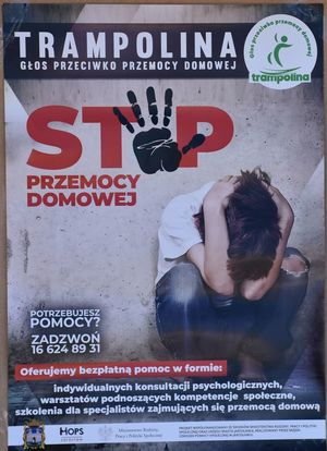 Plakat promujący akcję Miejskiego Ośrodka Pomocy Społecznej. Napis Trampolina, Stop przemocy domowej